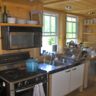 Kitchen area, Bosch gas stove and stainless steel sink and Bosch dishwasher